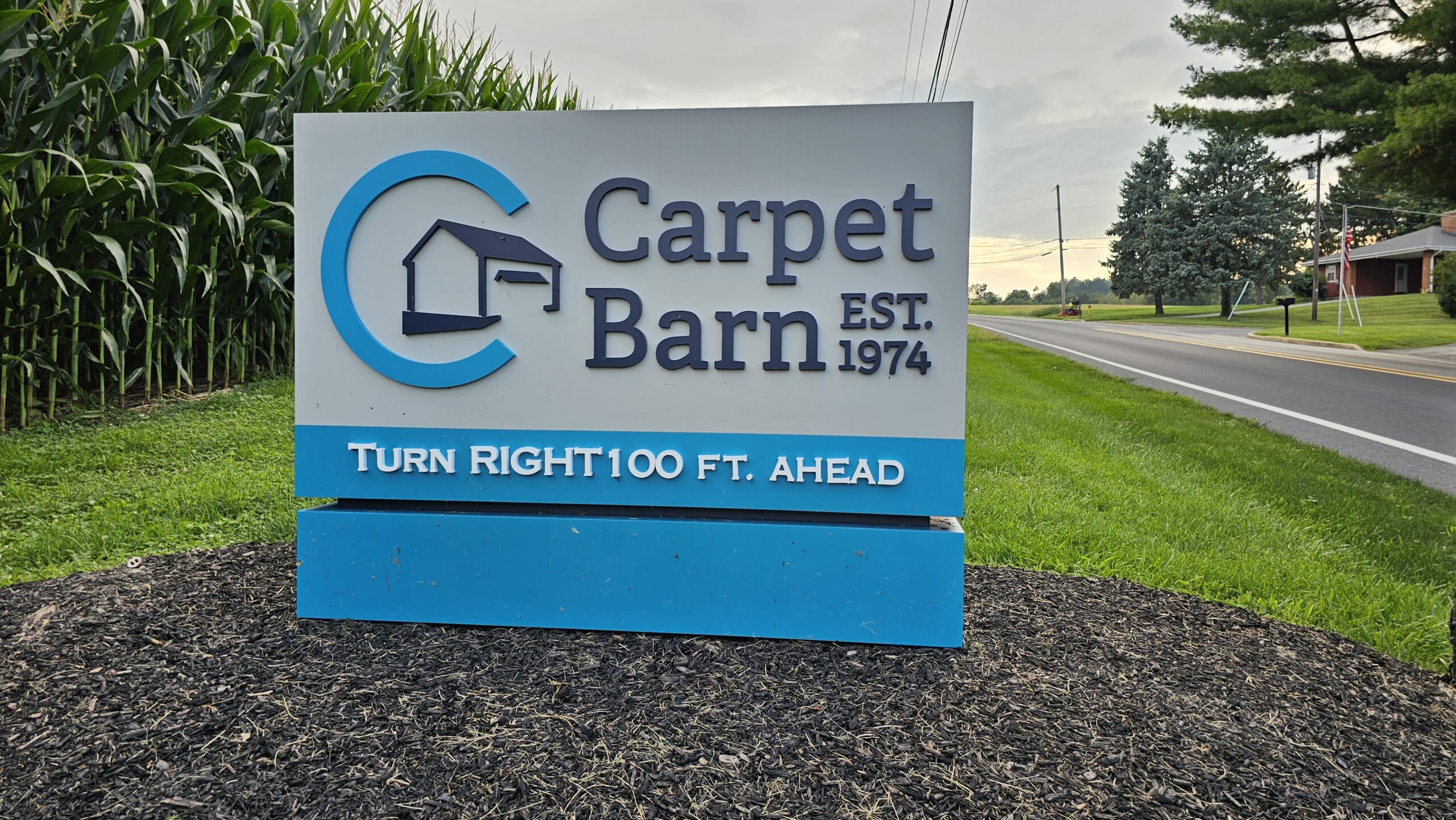 A photo of the Carpet Barn road sign