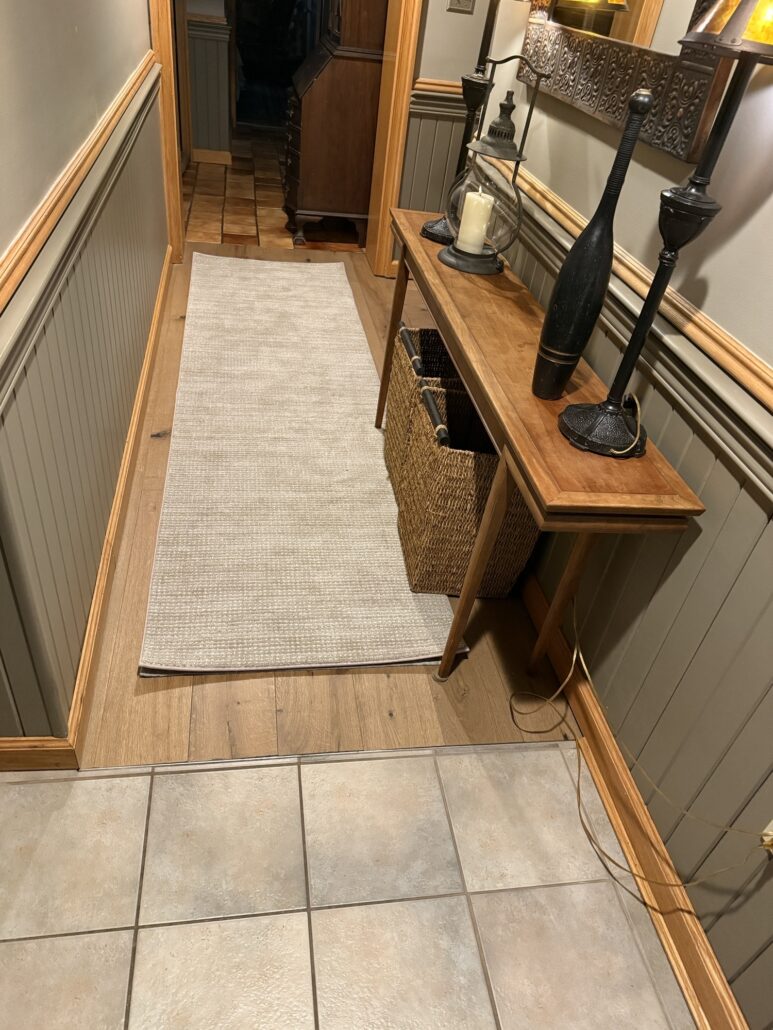 A photo of a piece of carpet being measured to make a custom hallway runner through the carpet binding process